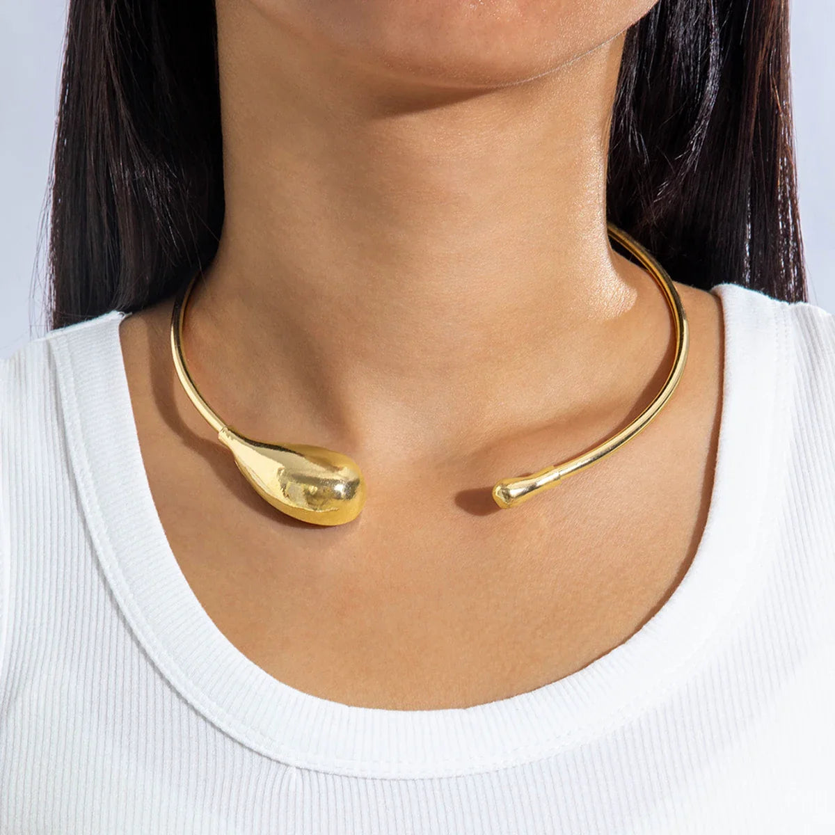 Gold geometric zinc alloy choker necklace for women worn with white top